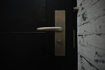 Door handle on black door