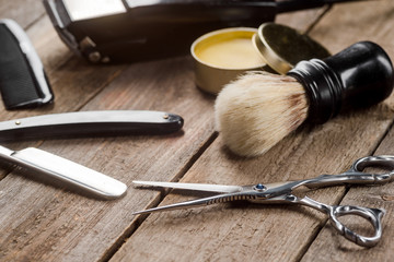 Barber scissors on wooden surface