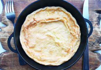 Omelet in a pan, a dish of eggs in a rustic style
