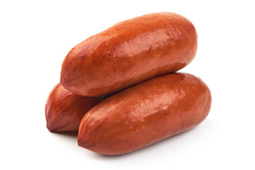 Delicious Smoked Sausages with basil leaves, close-up, isolated on a white background