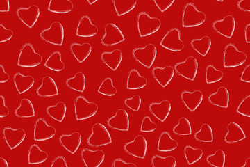 seamless pattern from white handdrawn hearts on a red background. Valentine's day