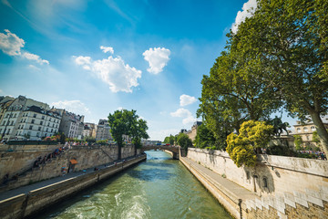 Fototapeta na wymiar Seine river passing by Ile de la Cite in Paris