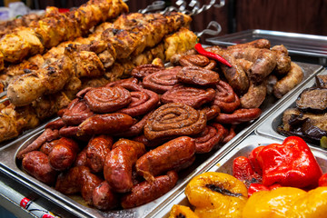 Grilled sausages, vegetables and meat.