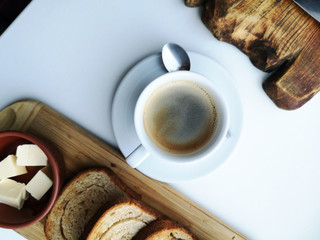 Delicious breakfast: coffee, croutons, scrambled eggs in a pan. Country Food