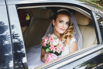 beautiful bride in the car