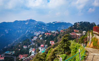 An Aerial landscape view of Mussoorie or Mussouri hill top peak city located in Uttarakhand India with colorful buildings