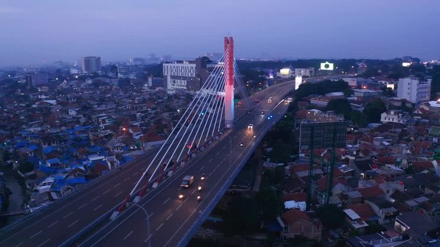 Bandung, Indonesia - January 02, 2019: Aerial landscape of Bandung cityscape with Pasupati Bridge and residential houses background in West Java, Indonesia. Shot in 4k resolution