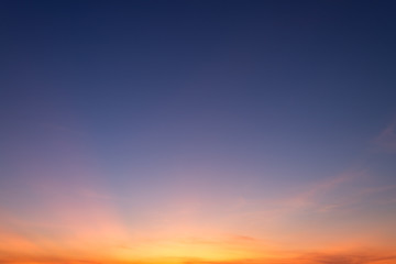 Orange sky background texture with white clouds sunset.
