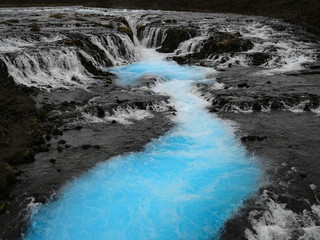 Turquoise blue Bruarfoss waterfall