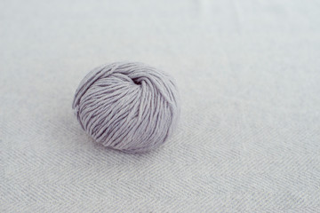 tangle of wool yarn on a gray background