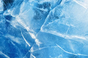 Poster Abstract ice background. Blue background with cracks on the ice surface © Leonid Ikan
