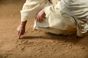 Jesus writing with his finger