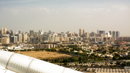 Dubai's buildings seen from the airplane taking off