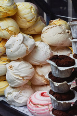 Meringue and other sweets in the shop window of the confectionery