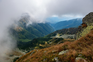 rocky Tatra mountain tourist hiking trails under blue sky in Slovakia