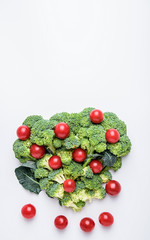 Broccoli dish and small tomatoes/supermarket fresh creative poster material on white background