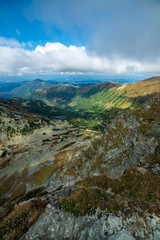 rocky Tatra mountain tourist hiking trails under blue sky in Slovakia