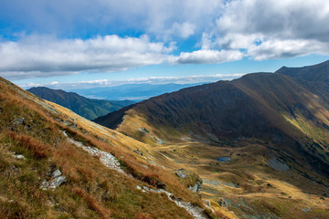 rocky Tatra mountain tourist hiking trails under blue sky in Slovakia
