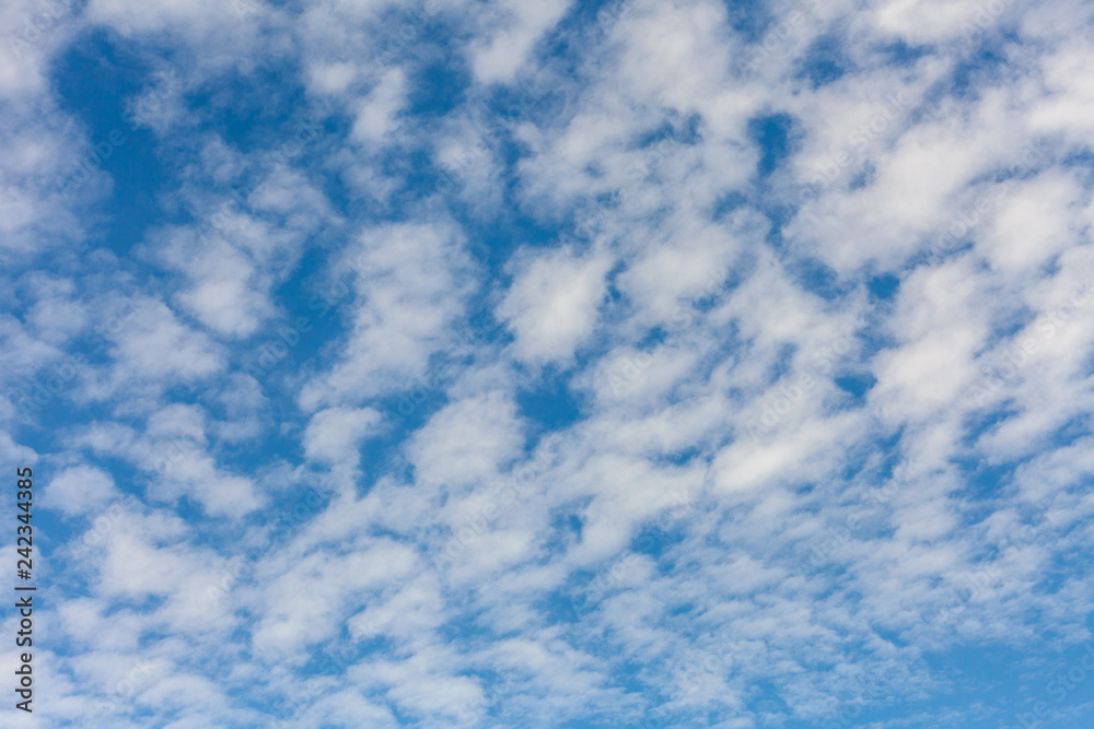 Wall mural nature sky texture with clouds look like waves from the sea.