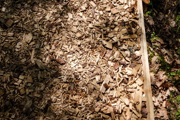 tourist trail covered with chipped dry wood