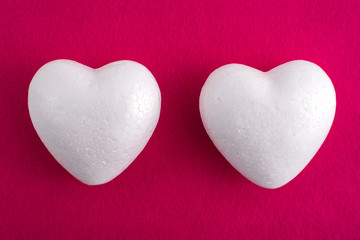 Obraz premium White foam heart on a red felt background