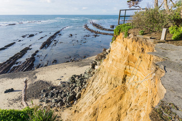 Collapsed paved road due to a landslide on the Pacific Ocean coastline, Moss Beach California