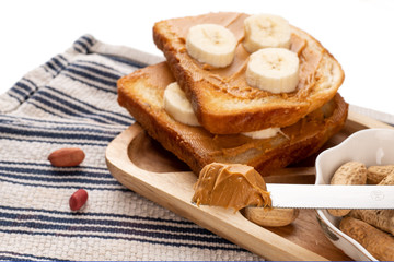 peanut butter on a slice of Toast. Isolated on a white background