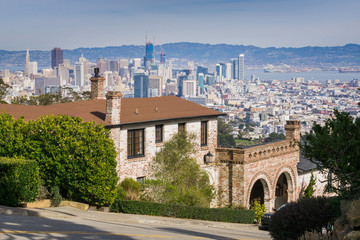 Street and houses in the residential area of San Francisco  downtown city views in the background, California © Sundry Photography