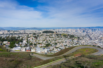 San Francisco panoramic view from Twin Peaks; winding road in the foreground, California