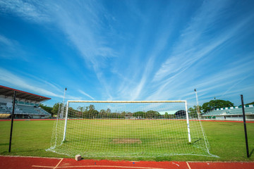 Obraz premium Stadium Soccer goal or football goal at of stadium with blue sky background.