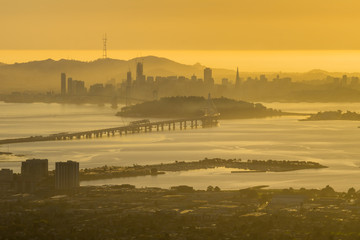 View towards San Francisco and the bay bridge at sunset, California