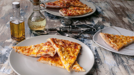 Pizza Four cheeses on a plate. Traditional Mediterranean cuisine