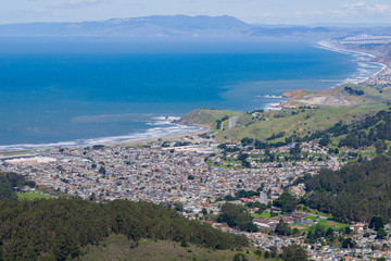 Aerial view of Linda Mar and Pacifica as seen from Montara mountain, San Francisco and Marin County in the background, California