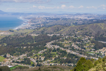 Fototapeta na wymiar Aerial view of Pacifica and San Pedro Valley as seen from Montara mountain, San Francisco and Marin County in the background, California