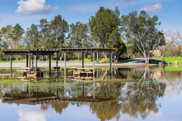 Fototapeta na wymiar Flooded meadow and picnic tables, Cunningham Lake, San Jose, south San Francisco bay, California