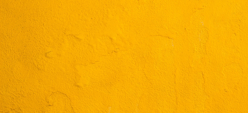 Old Cracked Yellow Painted Wall Background