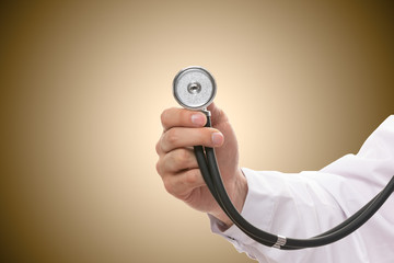 hand with stethoscope
