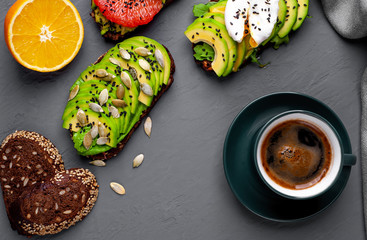 breakfast with avocado, sesame, orange, egg, coffee on a beta background
