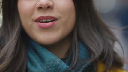 Mouth of a young Hispanic female talking directly to camera  - Powered by Adobe