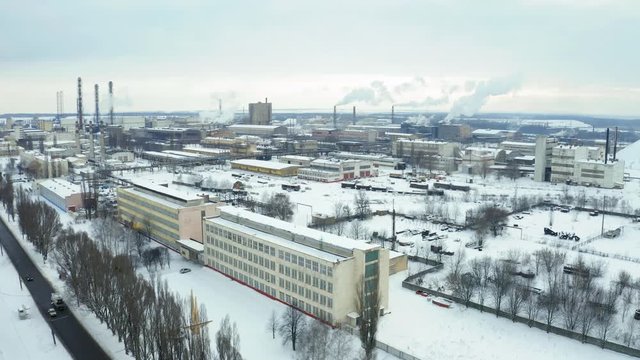 Fly over Sumykhimprom chemical industry plant in winter. Air pollution industry. Carcinogenic harm concept