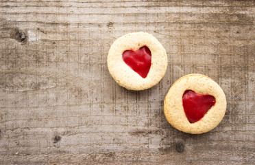 homemade linzer cookies with jam heart-shaped and decorations on wooden table free space for text - holidays, winter, celebration, Valentine's day concept