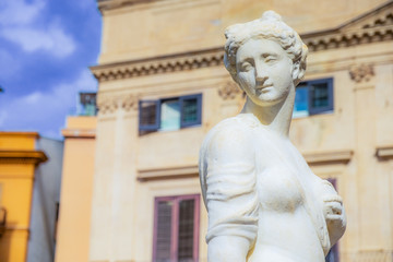 Fototapeta premium White stone Statue of woman in Palermo, Sicily. Historic fountain