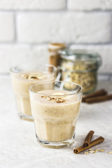Peanut butter oatmeal breakfast smoothie. Selective focus, space for text.