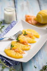 pineapple salad with smoked salmon and lemon peel