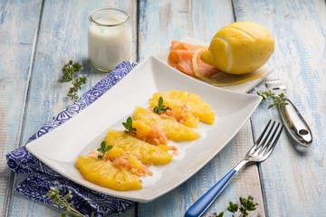pineapple salad with smoked salmon and lemon peel