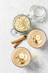 Peanut butter oatmeal breakfast smoothie. Selective focus, space for text.