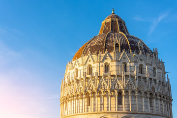 Fototapeta premium Roof and dome Pisa Baptistery sky before sunset.