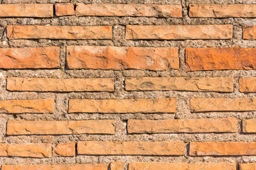 Fototapeta premium Ancient orange red brick of ancient times texture.