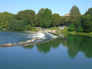 Turin, Italy - 12/01/2018: An amazing photography of the city of Turin from italy in summer days from the high and low part of the city including the beautiful river of Po from the center