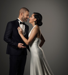 Couple Fashion Portrait, Elegant Man in Black Suit and Beautiful Woman in White Dress